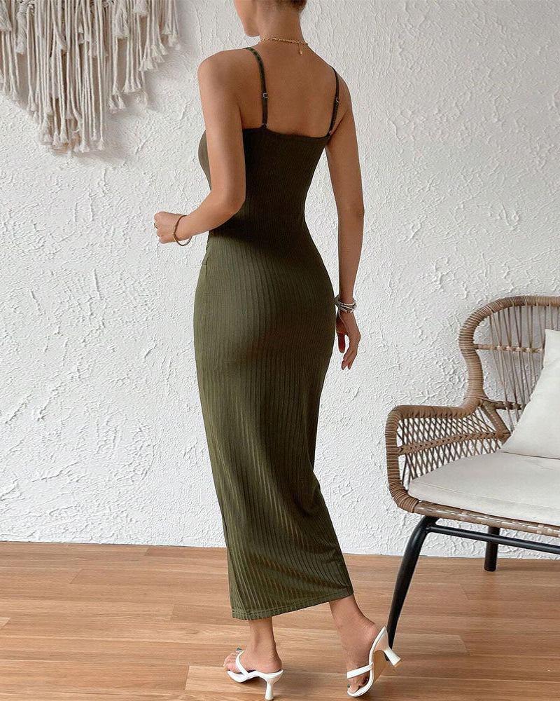 Back view of woman wearing olive green ribbed knit midi dress with spaghetti straps.