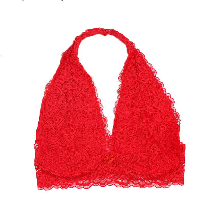 A red lace halter bralette laid flat, displaying scalloped edges and floral lace patterns
