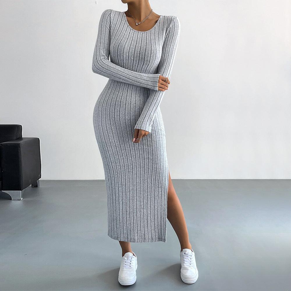 Light gray ribbed long-sleeve midi dress with side slit and white sneakers, emphasizing comfortable elegance