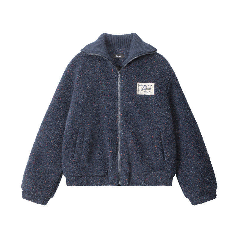 Navy blue teddy fleece bomber jacket with ribbed collar, Marule patch and front pockets. Cozy texture with speckled appearance