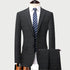 Charcoal gray plaid suit on mannequin with white shirt and blue striped tie against light background