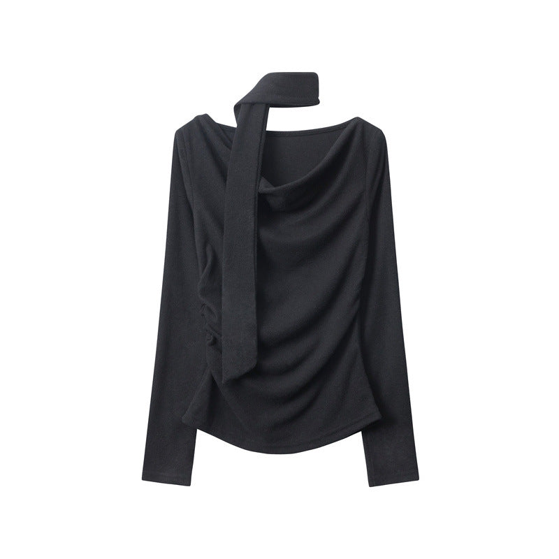 Black long-sleeve top with asymmetrical draped neckline and fabric scarf detail