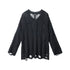 Black cable-knit sweater with V-neck design, long sleeves, and distressed details at hem. Semi-sheer knit construction with decorative holes