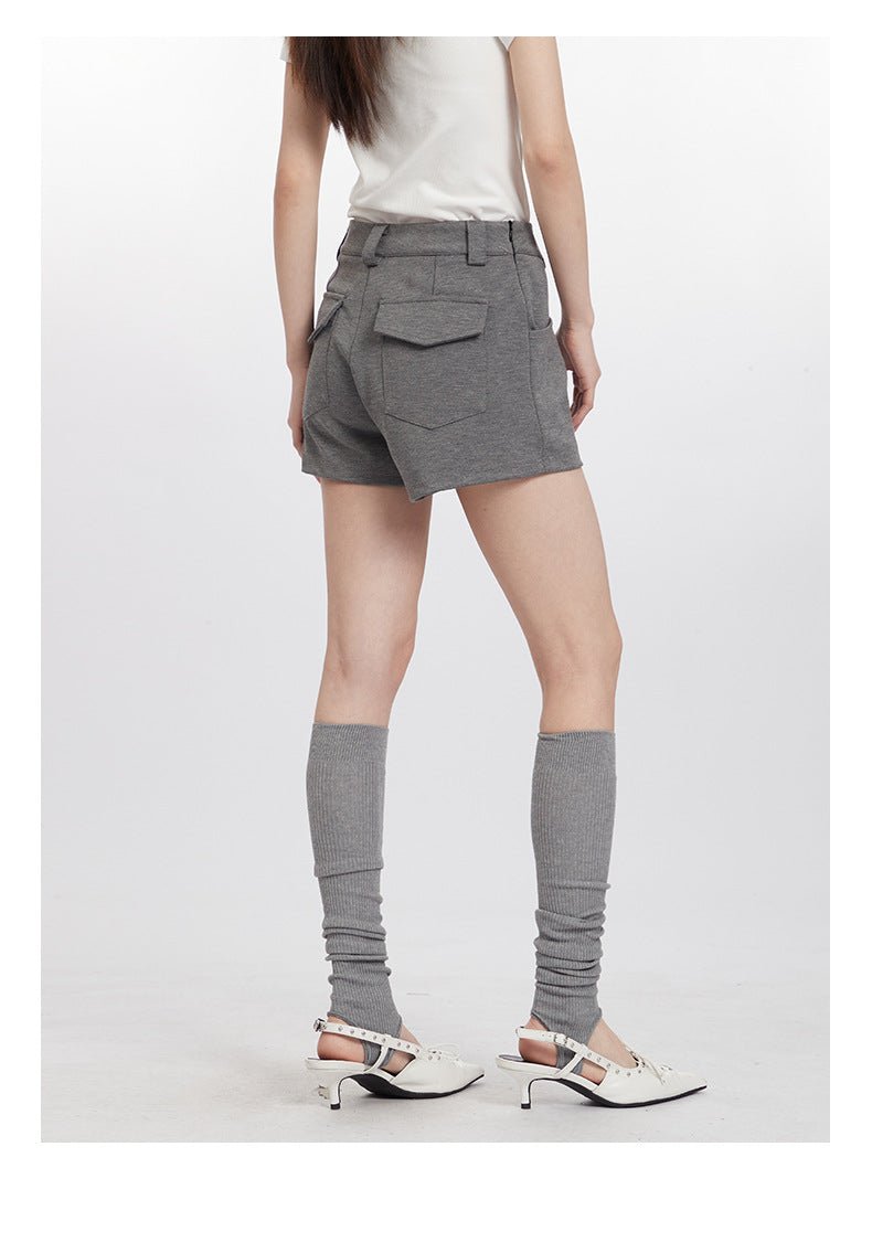 Back view of gray shorts showing double flap pockets and tailored construction