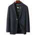 Navy wool blazer with DOWN FILLER sheep logo tag on wooden hanger, featuring two-button closure and quilted lining