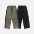 Two pairs of wide-leg sweatpants, one olive green and one black, both with drawstrings and subtle logo detailing