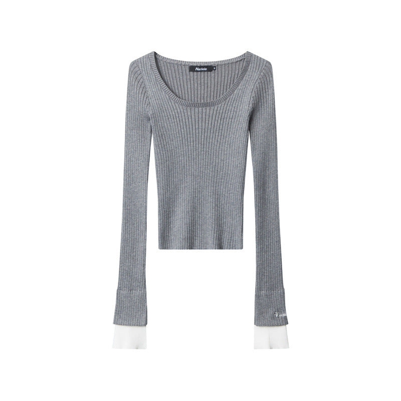 Heather grey ribbed knit top laid flat showing scoop neckline and white cuff detail with Nariele brand logo
