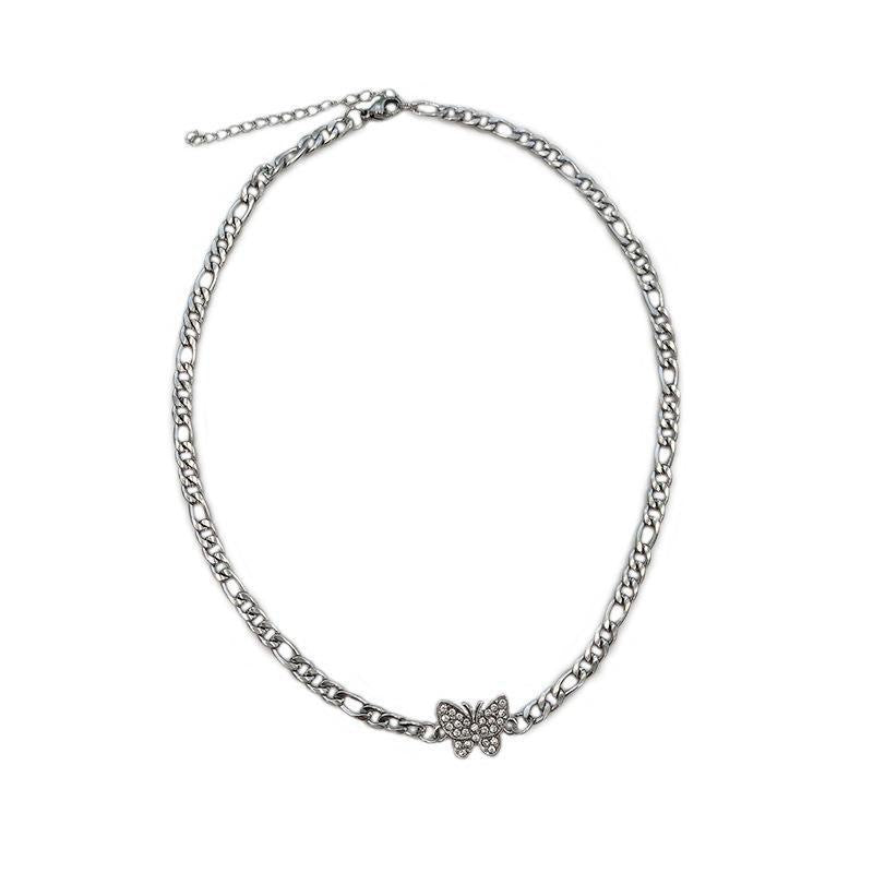 Silver Figaro chain necklace with crystal butterfly pendant shown on white background with adjustable clasp