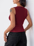 Back view of a woman in a fitted burgundy sleeveless ribbed top and black high-waisted jeans.