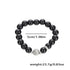 Black beaded bracelet with a marbled gray bead, displayed with a measurement of 5cm/1.96in diameter and a weight of 23.7g/0.83oz.
