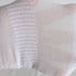 Close-up texture detail of white sock's breathable mesh knit pattern