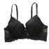 Product shot of black lace bra with molded cups, scalloped edge trim, and adjustable shoulder straps