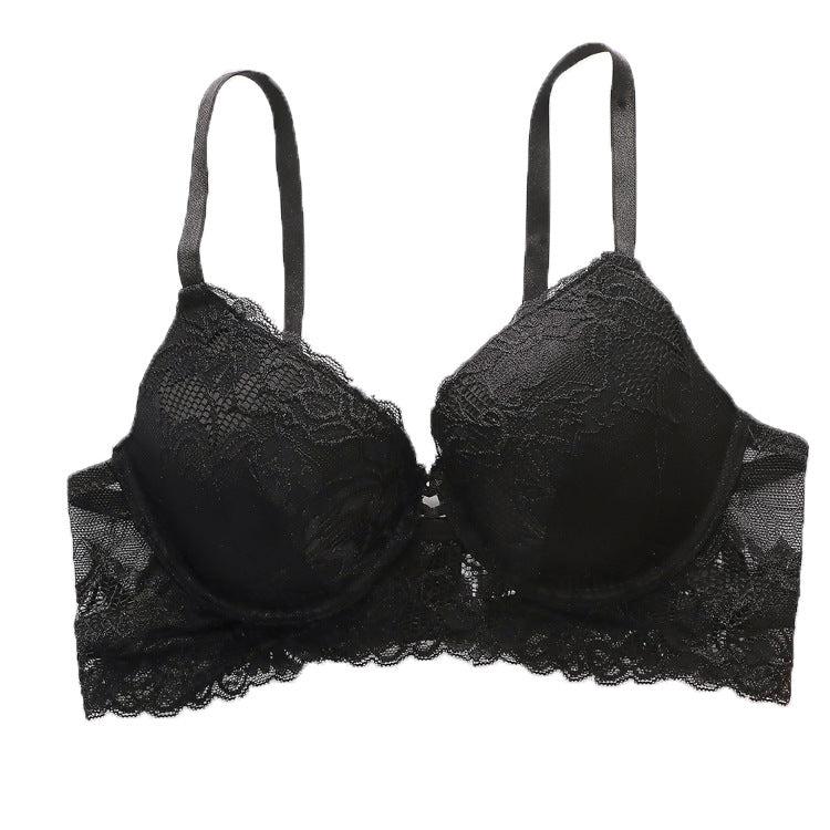 Product shot of black lace bra with molded cups, scalloped edge trim, and adjustable shoulder straps