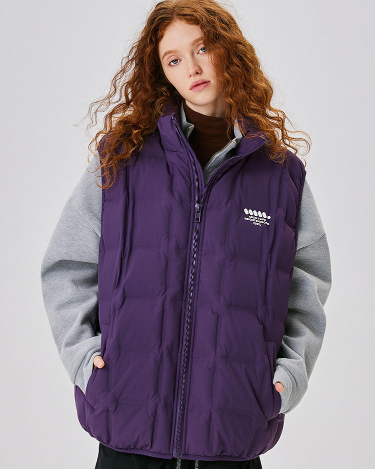 Model with auburn curly hair wearing purple down vest over gray sweater, turtleneck visible, Neightrainood brand logo, light gray background