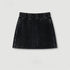 Black denim mini skirt with elastic waistband and drawstring, shown flat against white background