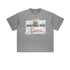 Product photo of gray oversized graphic t-shirt with adventure slogan on white background