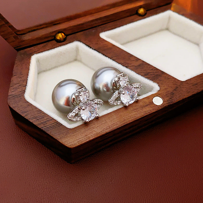 Pearl and crystal orbit earrings in luxury wooden jewelry box