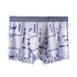 Men's boxer briefs with gray waistband and white fabric featuring blue vintage game-style pattern with jumping figures and icons