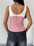 Back view of a woman in a red and white gingham tank top with a white ruched trim, highlighting the fitted cut and sleeveless design.