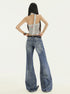 Front view wide leg denim pants with washed details, full body, one leg raised