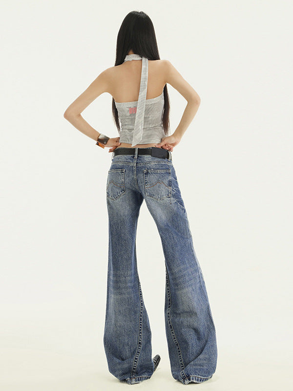 Front view wide leg denim pants with washed details, full body, one leg raised