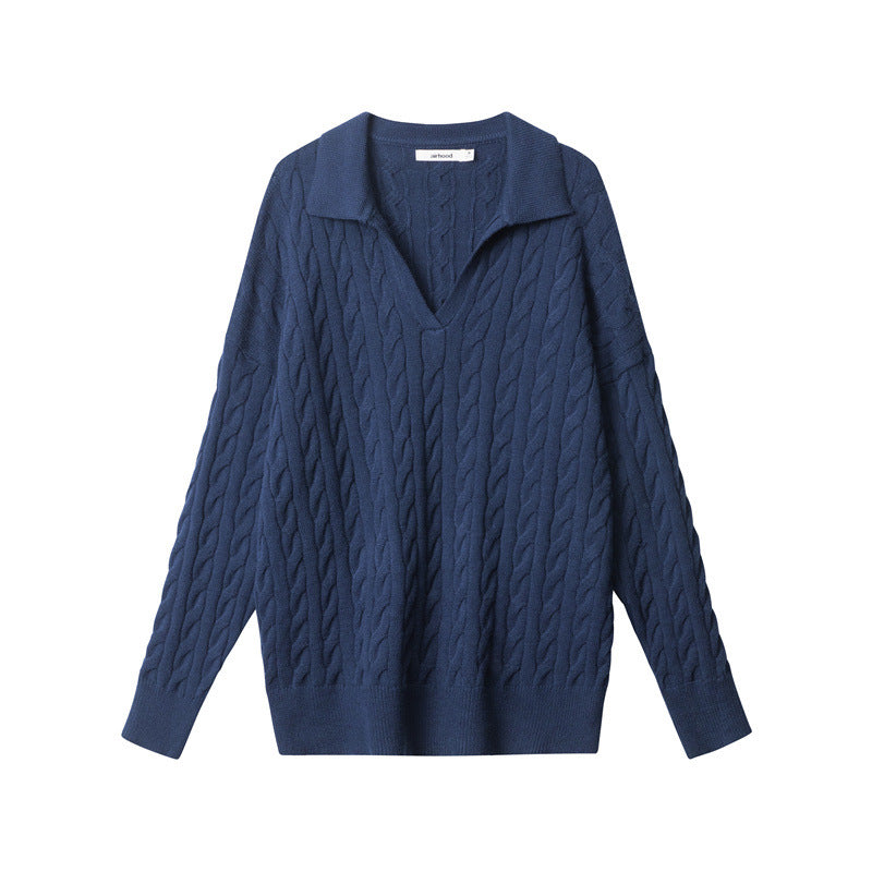 Navy V-neck polo sweater with all-over cable knit pattern and ribbed hem and cuffs.