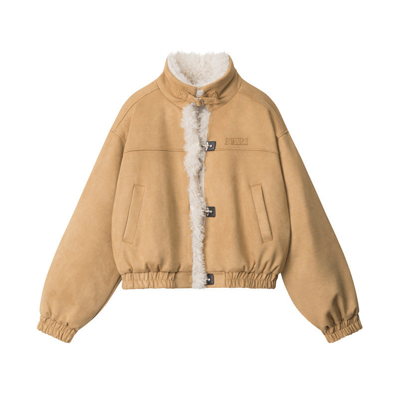 Tan shearling bomber jacket with white fleece trim and metal closures displayed flat against white background showing NARI embossed logo