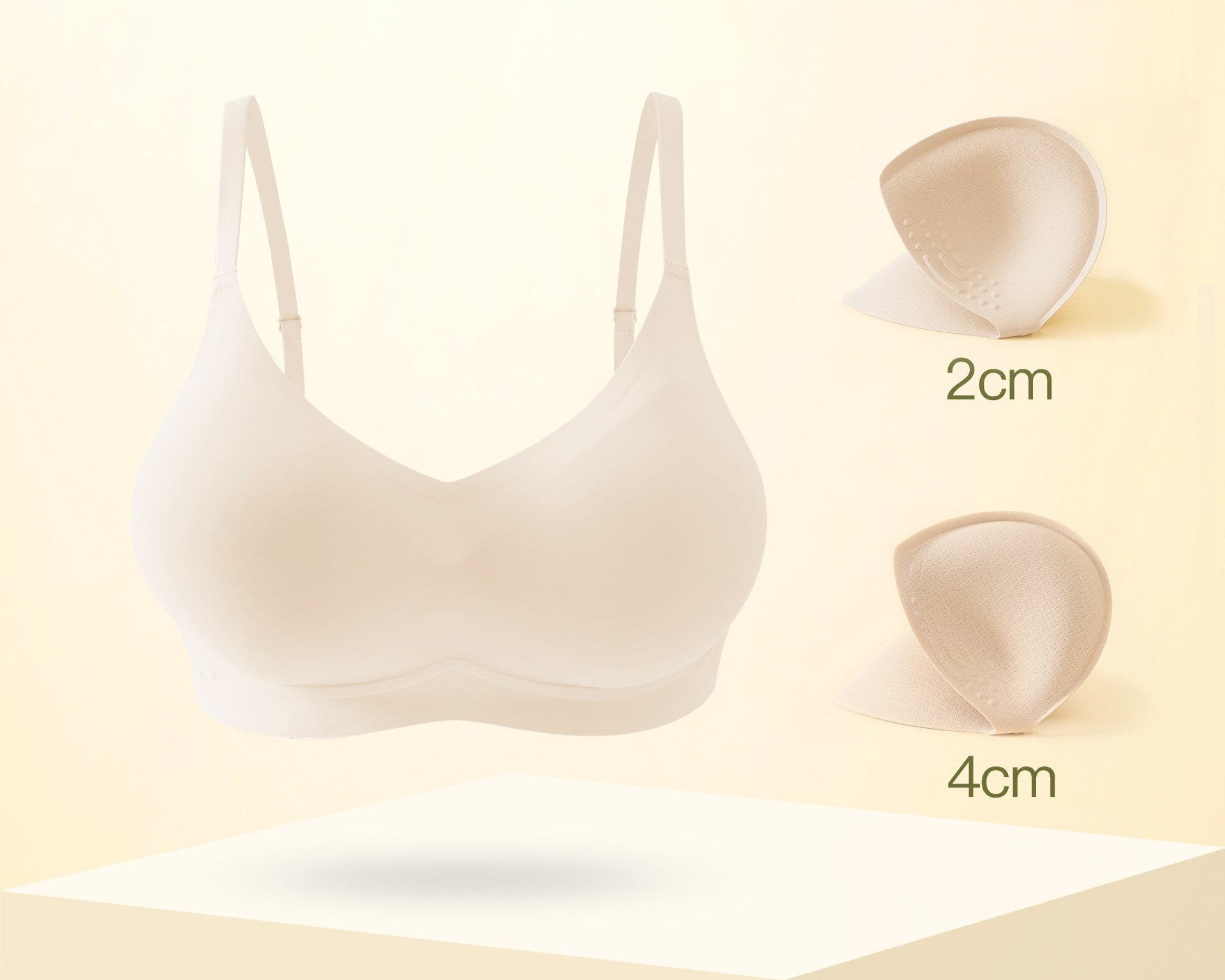 Beige seamless bra with removable 2cm and 4cm padding options.