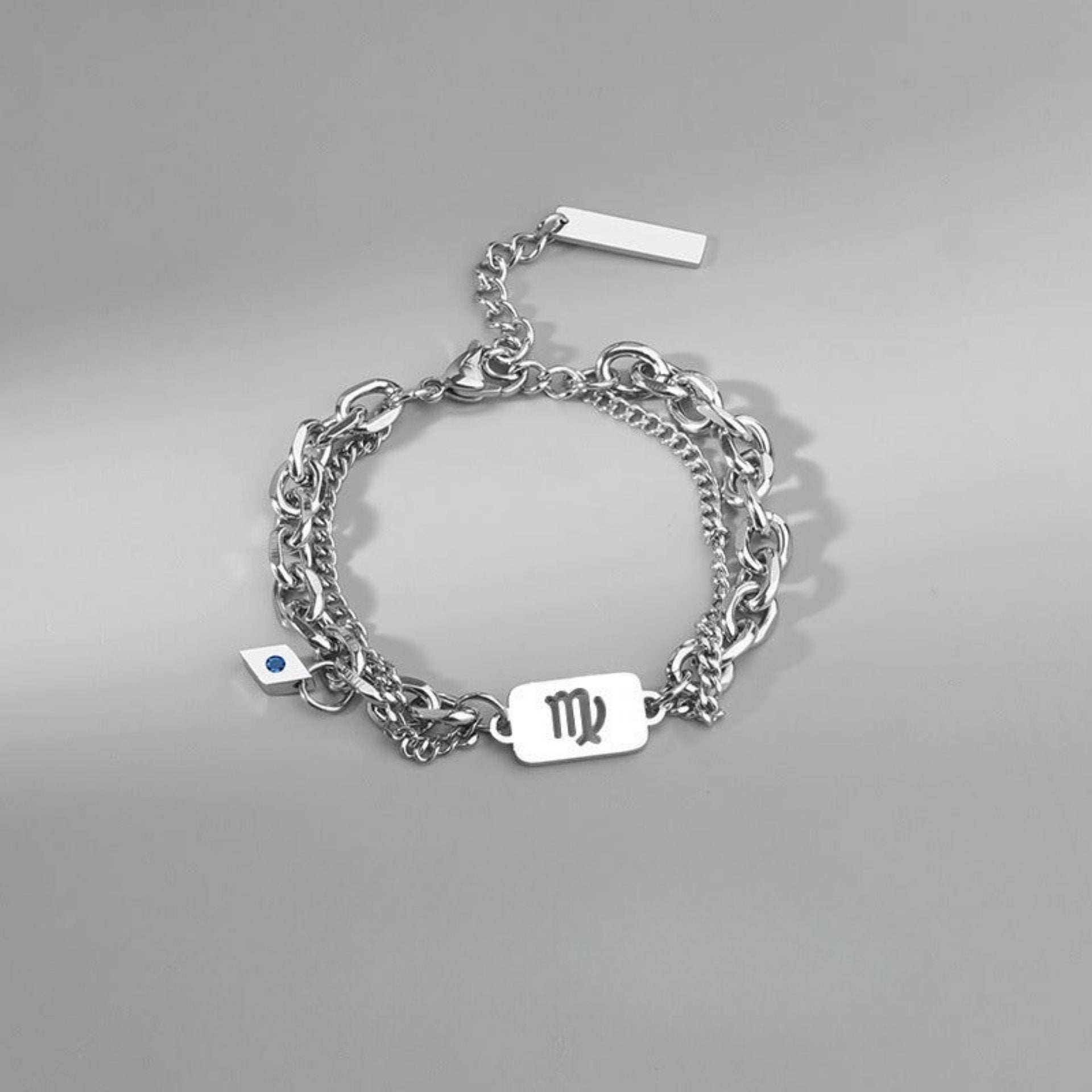 Elegant Virgo zodiac charm bracelet with a multi-layered chain, made of polished stainless steel.