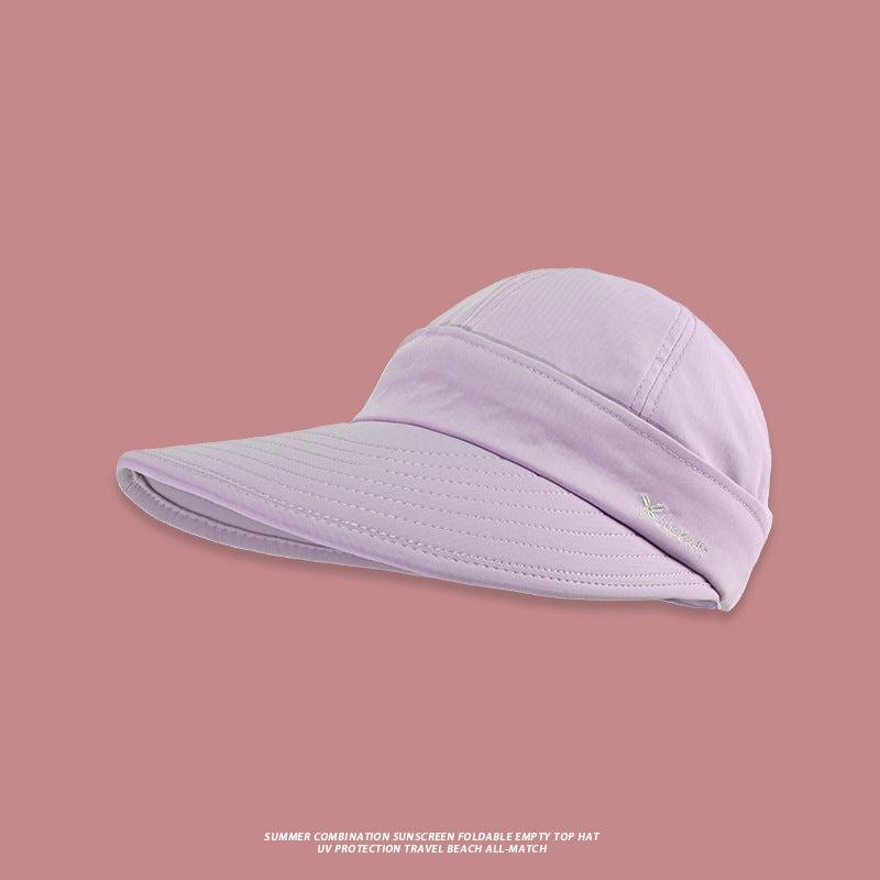 A lavender UV protection sun hat with extra-wide brim and small logo embroidery against contrasting mauve background