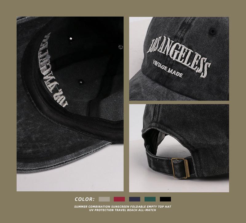 Close-up details of black Los Angeles cap showing interior embroidery, front logo and adjustable brass buckle strap
