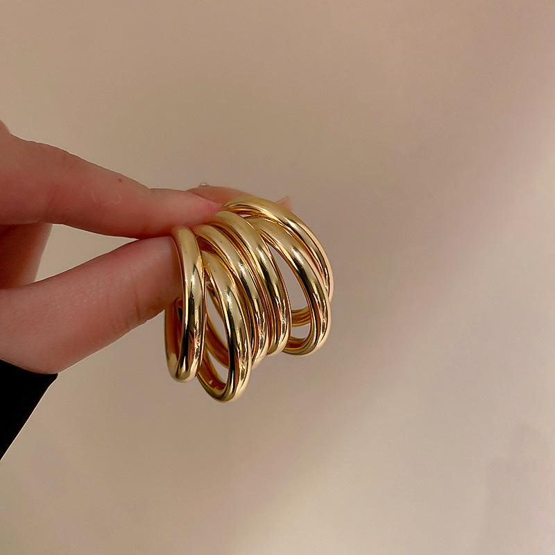 Multi-layered gold hoop earrings with modern design