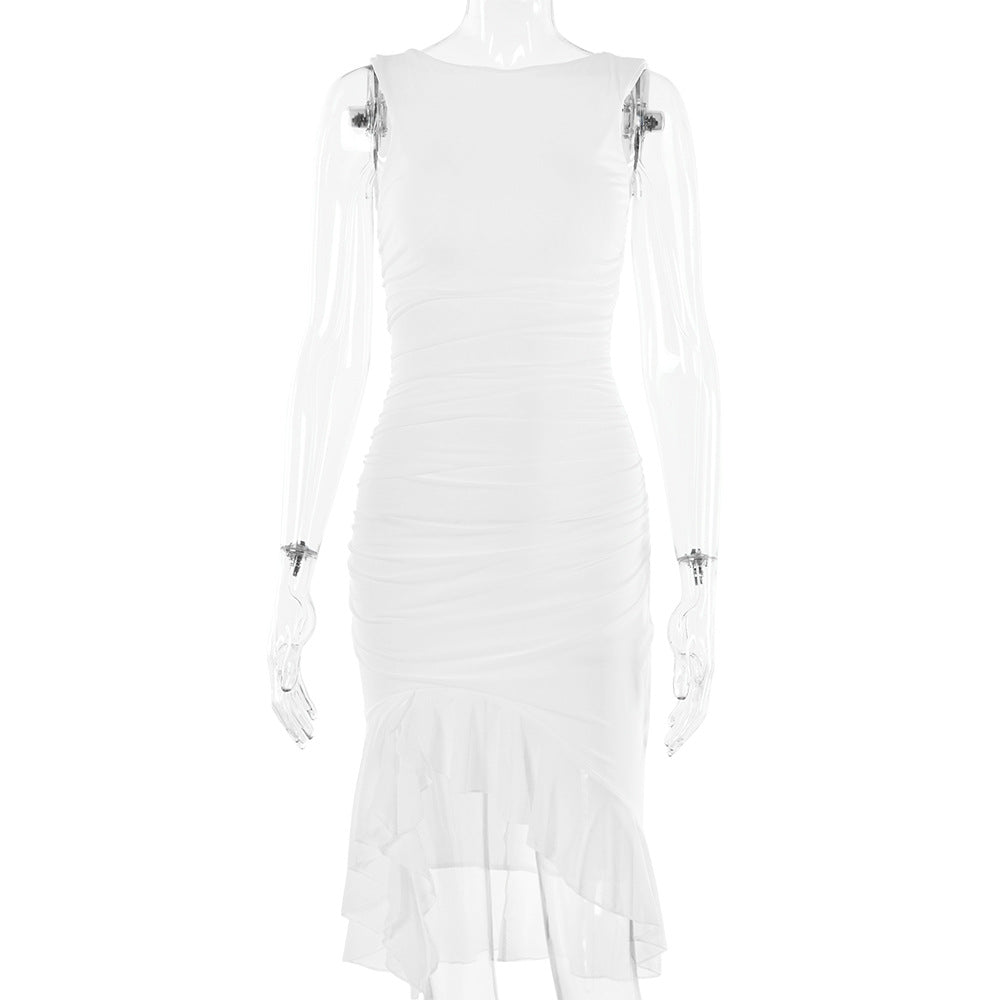 A model is wearing a white sleeveless ruched bodycon dress with asymmetrical ruffled hem, displayed against white background