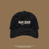 Black corduroy baseball cap with white 'NEW YORK' graffiti embroidery
