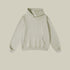 Light sage green hoodie with front pocket on light neutral background
