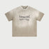 Beige Breaking Tradition oversized t-shirt with gothic text logo on light background