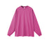Oversized magenta long sleeve sweatshirt with crew neck and ribbed cuffs on white background