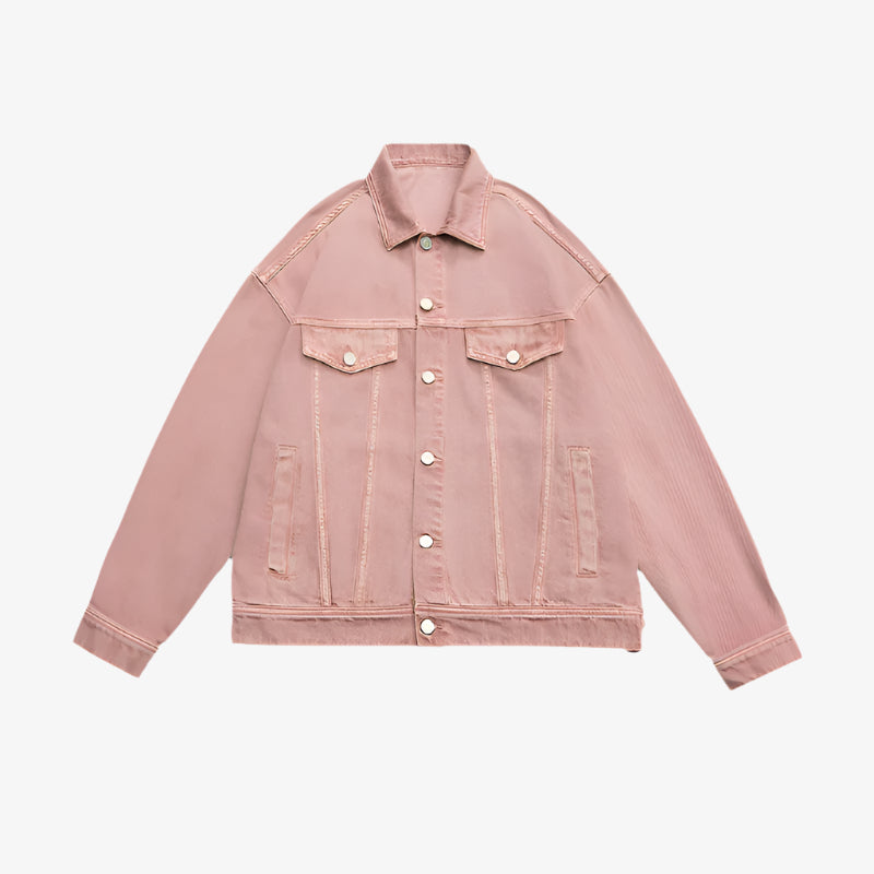 Pale pink oversized denim jacket with silver buttons and dual chest pockets displayed flat against white background