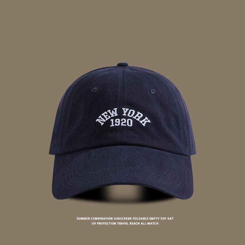 Navy blue baseball cap with white embroidered "New York 1920" text