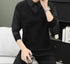 Black V-neck sweater with pinstriped collar detail