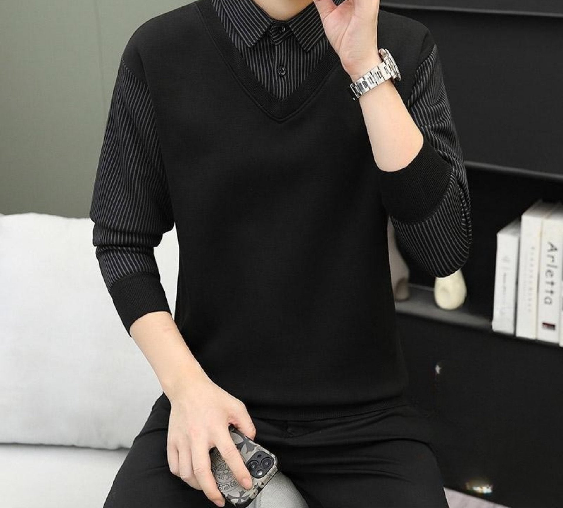 Black V-neck sweater with pinstriped collar detail