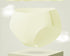 Ultra-thin cooling seamless brief in jasmine yellow color, floating above white pedestal with cloud effects in light gray background