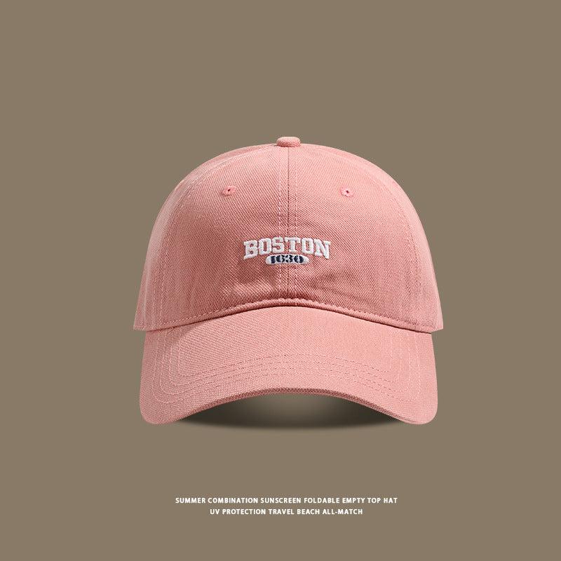 Pink baseball cap with white Boston 1630 logo embroidery detail
