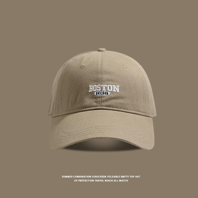 Khaki baseball cap featuring white Boston 1630 embroidery detail