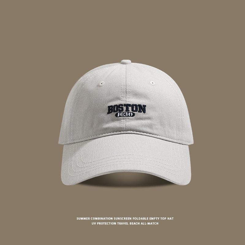 Light gray baseball cap with black Boston 1630 logo detail