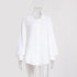 A white textured cotton button-down shirt with collar and long sleeves displayed on transparent mannequin against white background