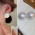Split image: Pearl earring worn on ear and close-up of iridescent pearl studs with frosted finish