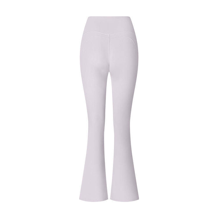 White high-waisted flared yoga pants with V-shaped waistband detail against white background, front view