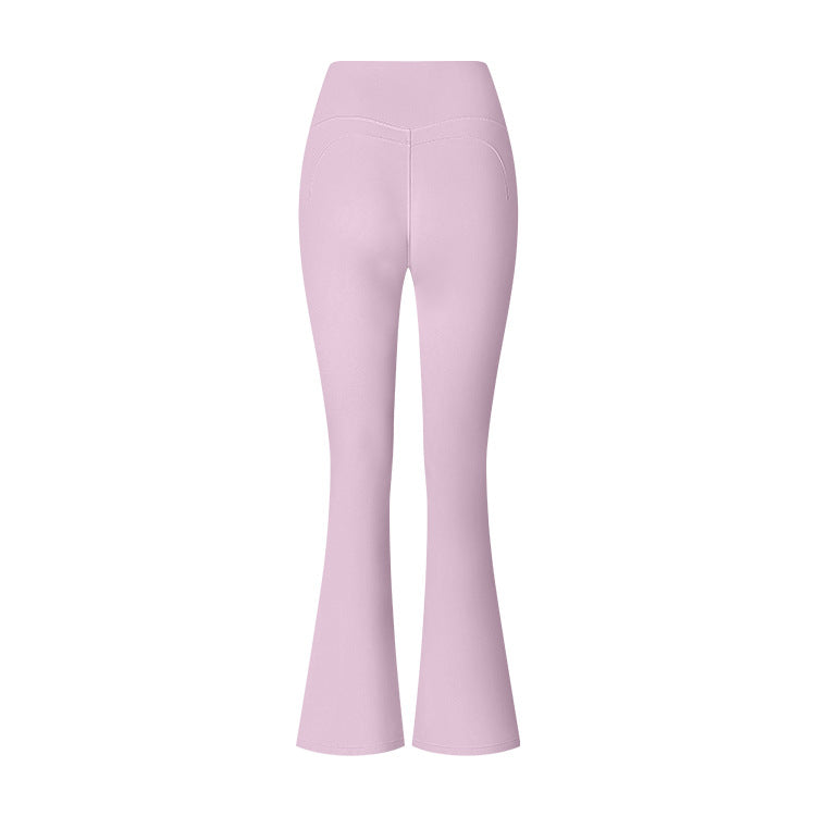 Lilac flared yoga pants with high waistband and subtle seam details, front view on white surface