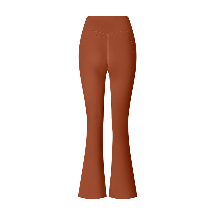 Terracotta flared yoga pants featuring high waist and curved seam details, displayed on white background
